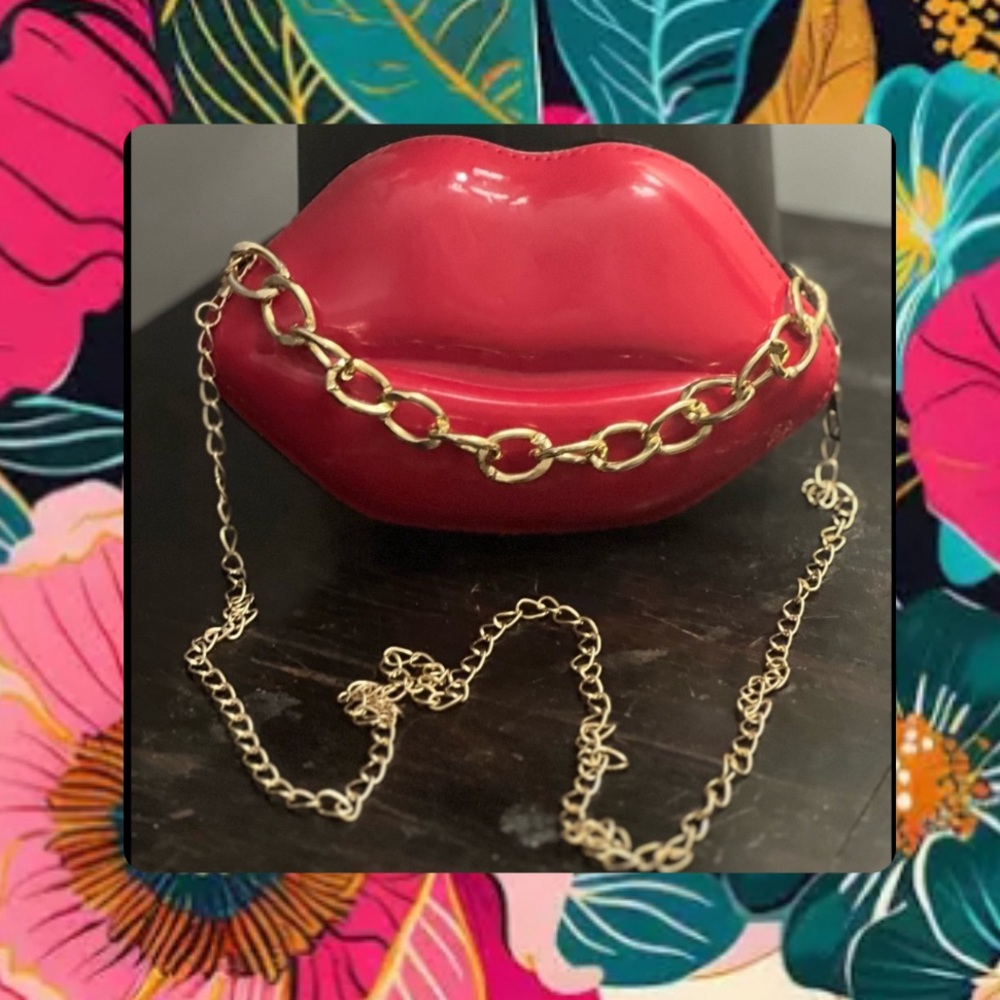 Red lips purse.